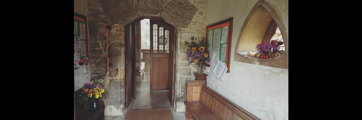 St George's Church porch with harvest flowers